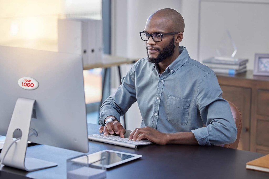 Young businessman using a computer in an office at work