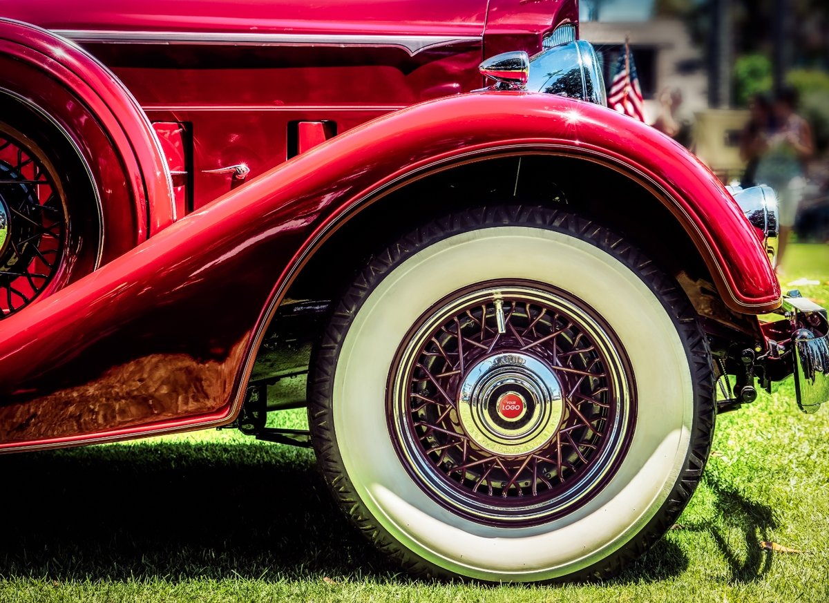 Old car with domed label on the rim