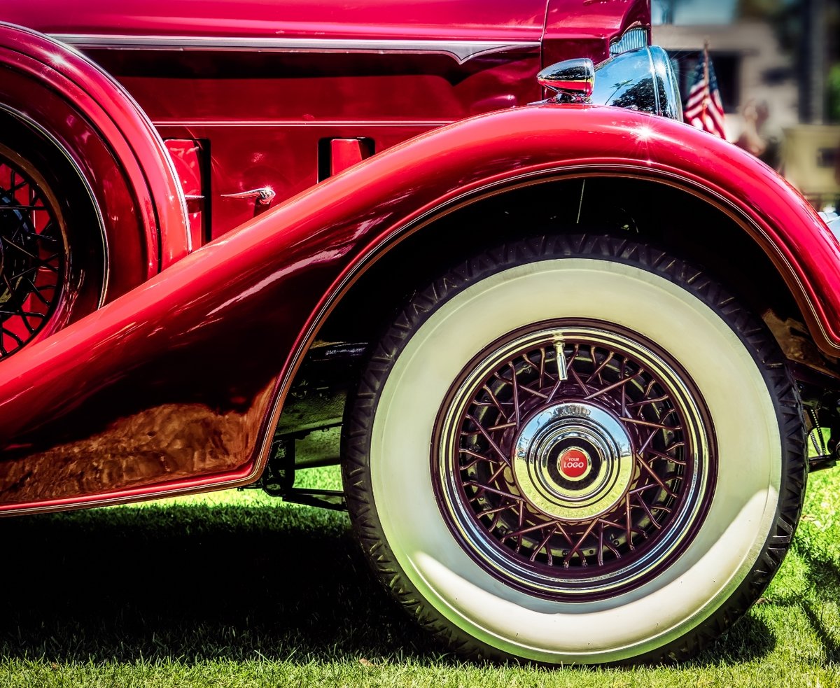 Old car with domed label on the rim